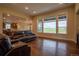 Spacious living room featuring hardwood floors and large windows with great natural light at 11259 Kalispell St, Commerce City, CO 80022