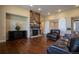 Comfortable living room with fireplace, hardwood floors and access to the dining room at 11259 Kalispell St, Commerce City, CO 80022
