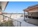 The backyard has a fence, snow, and a covered patio at 1832 Simms St, Lakewood, CO 80215