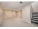 Spacious basement with neutral carpet and stairs at 1832 Simms St, Lakewood, CO 80215
