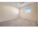 Neutral carpeted bedroom with ceiling fan, closet and window at 1832 Simms St, Lakewood, CO 80215