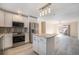 Modern kitchen with stainless steel appliances and island at 1832 Simms St, Lakewood, CO 80215