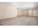 Spacious living room featuring light gray vinyl flooring at 1832 Simms St, Lakewood, CO 80215