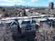 Aerial view of residential homes with a backdrop of downtown city skyline at 1489 Steele St # 310, Denver, CO 80206