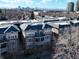 Apartment building with balconies and a brick and gray siding exterior and cityscape view at 1489 Steele St # 310, Denver, CO 80206