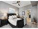 Inviting bedroom with a queen-sized bed, soft carpet, and a view of a walk-in closet at 1489 Steele St # 310, Denver, CO 80206