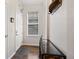 Bright entryway features hardwood floors, console table, and ample natural light at 1489 Steele St # 310, Denver, CO 80206