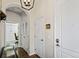 Inviting entryway with hardwood flooring, neutral walls, and a charming arched doorway at 1489 Steele St # 310, Denver, CO 80206