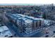 Modern brick apartment building featuring private balconies, conveniently located on a city street at 1489 Steele St # 310, Denver, CO 80206