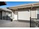 Welcoming covered entryway on a tiled outdoor patio with lovely railing at 1489 Steele St # 310, Denver, CO 80206
