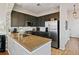 Well-equipped kitchen featuring granite countertops, stainless steel appliances, and dark wood cabinetry at 1489 Steele St # 310, Denver, CO 80206