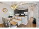 Modern kitchen and dining area featuring updated lighting and stainless steel appliances at 1489 Steele St # 310, Denver, CO 80206