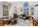 Cozy living room featuring a fireplace, comfortable seating, and plenty of natural light at 1489 Steele St # 310, Denver, CO 80206
