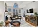 Comfortable living room with a fireplace, large windows, and cozy seating at 1489 Steele St # 310, Denver, CO 80206