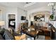 Open-concept living room with an archway to the kitchen and a view of the bedroom at 1489 Steele St # 310, Denver, CO 80206