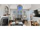 Bright living room features a fireplace, large windows, and access to an outdoor balcony at 1489 Steele St # 310, Denver, CO 80206