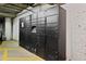 Secured storage lockers with electronic access in a concrete parking garage area at 1489 Steele St # 310, Denver, CO 80206