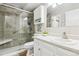 Updated bathroom with walk-in shower and white cabinets at 13606 E Bates Ave # 208, Aurora, CO 80014