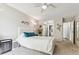 Spacious bedroom with white bed frame and ensuite access at 13606 E Bates Ave # 208, Aurora, CO 80014