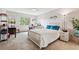 Cozy bedroom with a white bed frame and teal bedding at 13606 E Bates Ave # 208, Aurora, CO 80014
