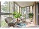Relaxing sunroom with wicker furniture and a view of the outdoors at 13606 E Bates Ave # 208, Aurora, CO 80014