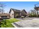 Spacious backyard boasts a lounge area, fire pit, artificial turf, and a private patio, perfect for entertaining at 4445 Wolff St, Denver, CO 80212