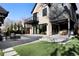 Beautiful backyard featuring a patio, artificial turf, and meticulously landscaped yard, perfect for outdoor enjoyment at 4445 Wolff St, Denver, CO 80212