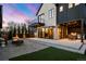 Inviting backyard featuring a patio, fire pit, outdoor kitchen, and a balcony, perfect for entertaining and relaxation at 4445 Wolff St, Denver, CO 80212