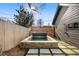 Charming backyard features a stylish plunge pool, stone accents, and paved walkways for outdoor leisure at 4445 Wolff St, Denver, CO 80212