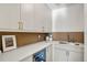 Modern Butler's Pantry boasting sleek white cabinets, stylish hardware, and a convenient wine fridge at 4445 Wolff St, Denver, CO 80212