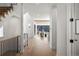 Bright foyer with hardwood floors, featuring a staircase and an open view into the living area, creating a welcoming space at 4445 Wolff St, Denver, CO 80212