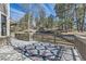 Enjoy outdoor living on this expansive wood deck overlooking a backyard with mature trees at 5352 Pinyon Jay Rd, Parker, CO 80134