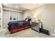 Basement bedroom featuring a large bed, stylish nightstand, and a window for natural light at 5352 Pinyon Jay Rd, Parker, CO 80134