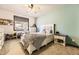 Bright bedroom featuring a ceiling fan, a window, and light-colored walls at 5352 Pinyon Jay Rd, Parker, CO 80134