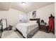 Bedroom with a full bed, neutral colors, and a black dress form at 5352 Pinyon Jay Rd, Parker, CO 80134