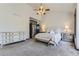 Serene main bedroom with vaulted ceilings, a ceiling fan, and a stylish dresser at 5352 Pinyon Jay Rd, Parker, CO 80134