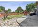 Inviting backyard featuring a patio, a grassy area, and rock landscaping at 8445 Lamar Dr, Arvada, CO 80003