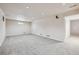 Spacious unfinished basement space with carpet, speaker, and natural light at 8445 Lamar Dr, Arvada, CO 80003