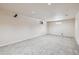 Unfinished basement space with neutral carpet, recessed lighting, and small window at 8445 Lamar Dr, Arvada, CO 80003