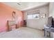 Cozy bedroom featuring soft, neutral-toned walls and a natural light-filled window view at 8445 Lamar Dr, Arvada, CO 80003