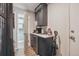 Coffee bar area equipped with modern appliances, sleek cabinetry, and a beverage cooler at 8445 Lamar Dr, Arvada, CO 80003