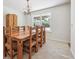 Bright dining room featuring a wood table with seating for eight and a decorative chandelier at 8445 Lamar Dr, Arvada, CO 80003