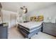 Bright bedroom featuring two beds, two dressers, and a modern ceiling fan at 8445 Lamar Dr, Arvada, CO 80003