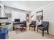 This office boasts a dark desk, printer, two gray chairs, and natural light at 8445 Lamar Dr, Arvada, CO 80003