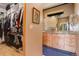Bright bathroom featuring double vanity, granite counters, and view windows at 116 Ramona Rd, Golden, CO 80403