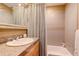 Bathroom featuring sink with granite counters and shower with tiled backsplash at 116 Ramona Rd, Golden, CO 80403
