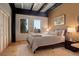 Serene bedroom with neutral tones, bright windows, and an exposed ceiling at 116 Ramona Rd, Golden, CO 80403