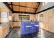 Modern kitchen with stainless steel appliances, granite countertops, light wood cabinets, and an island with bar seating at 116 Ramona Rd, Golden, CO 80403
