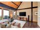 Vaulted living room with wood beam features a ceiling, large windows, hardwood floors, and a view at 116 Ramona Rd, Golden, CO 80403
