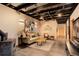 Comfortable living room with neutral palette, wood burning stove, and exposed ceiling at 116 Ramona Rd, Golden, CO 80403